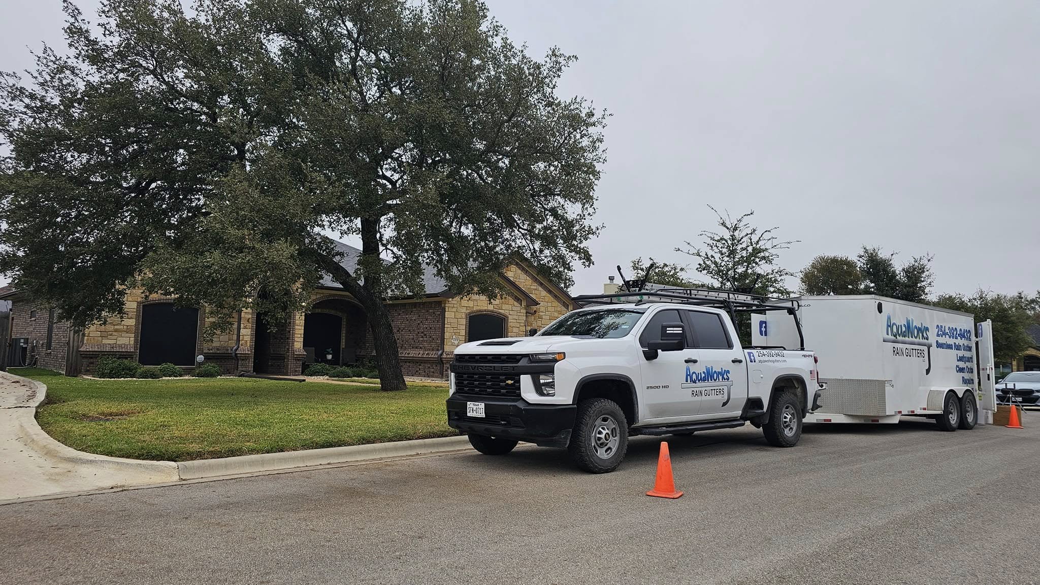 AquaWorks® Rain Gutters installation trailers on-site for gutter fabrication