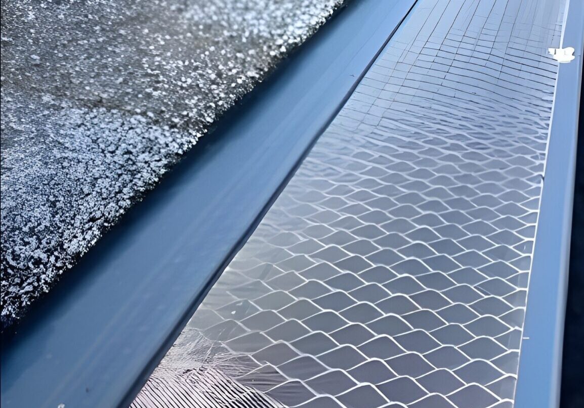 Close up view of gutter leaf guard system installed on roofline