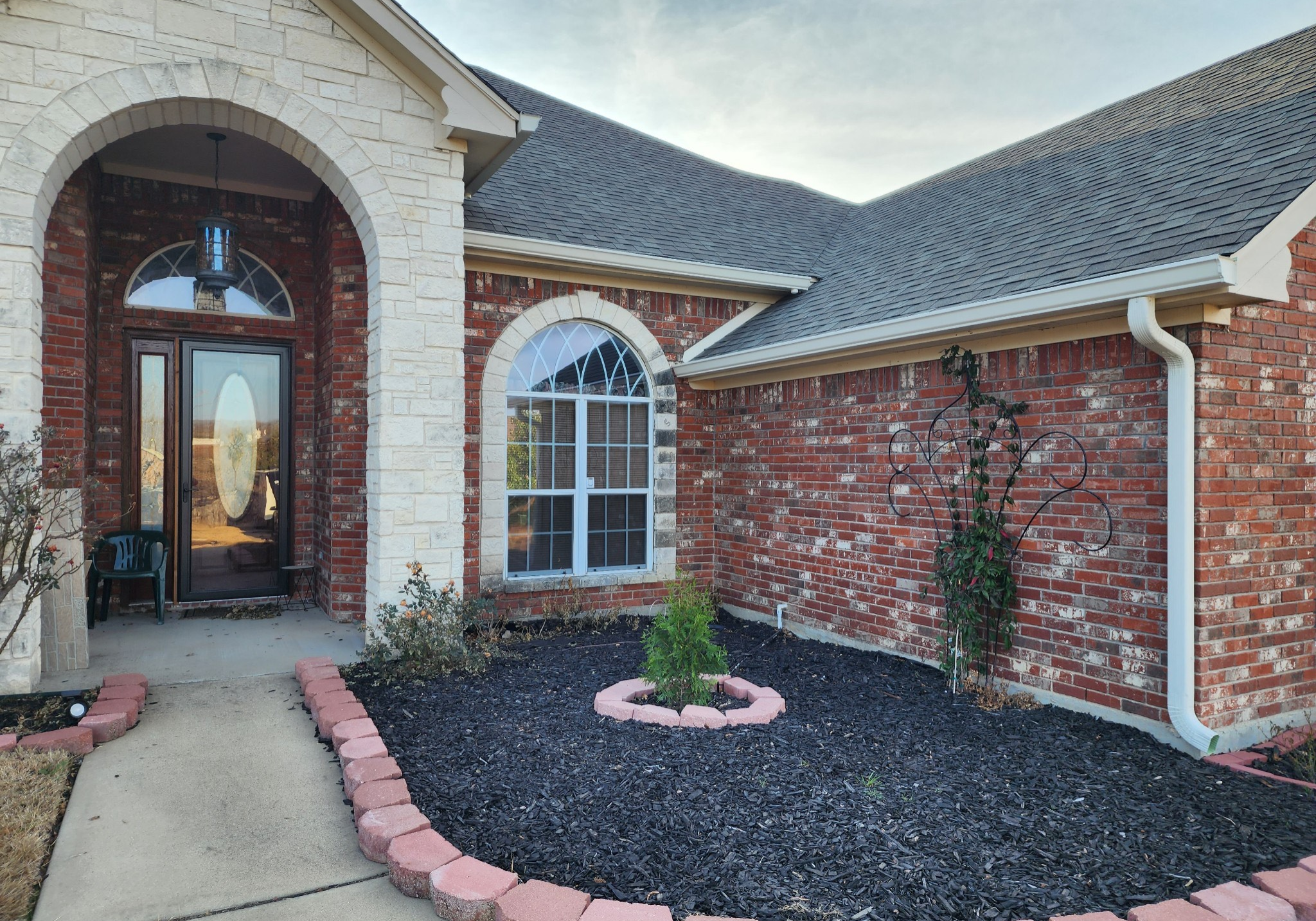 AquaWorks® Rain Gutters custom downspouts and seamless gutters installed for proper drainage on a Texas home