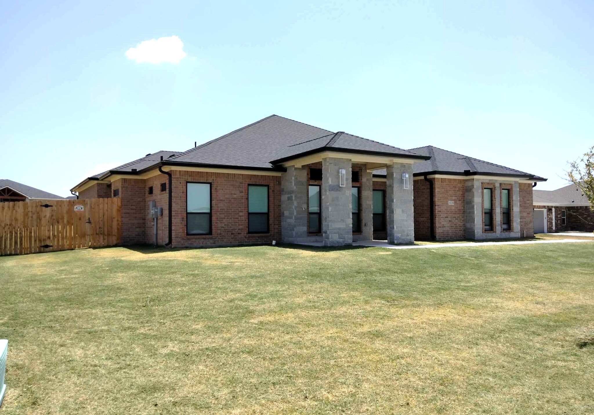 Residential gutter installation on Texas home exterior